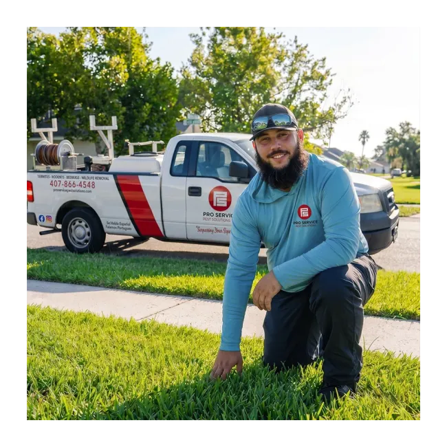 Technician kneeling in front of truck