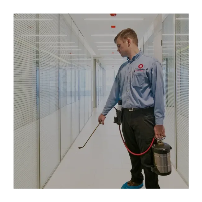 technician spraying office building